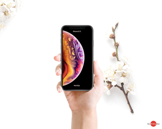Free Woman Holding Iphone Xs Mockup Psd With Flowers