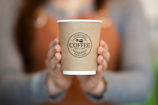 Free Woman Holding Paper Coffee Cup Mockup Psd