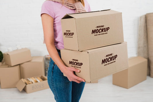 Free Woman Holding Two Moving Boxes Mock-Up Psd