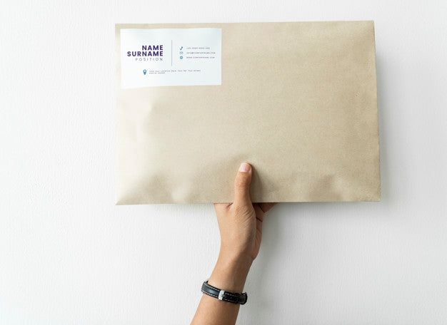 Free Woman Holding Up A Package Mockup Psd