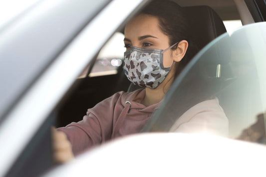 Free Woman In Car Wearing Mask Psd