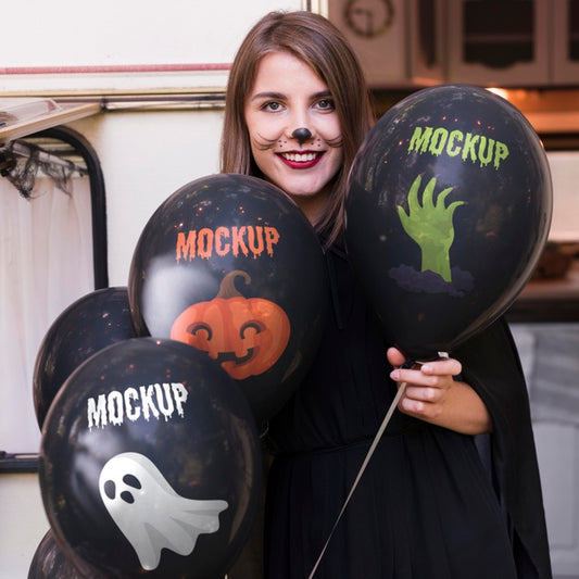 Free Woman In Halloween Costume Holding Mock-Up Balloons Psd