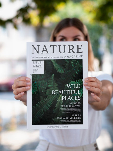Free Woman Showing A Nature Magazine Mock Up Psd