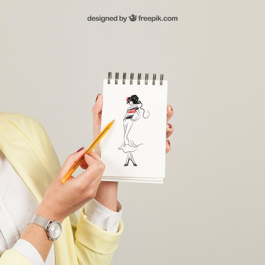 Free Woman Showing Drawing On Notepad Psd
