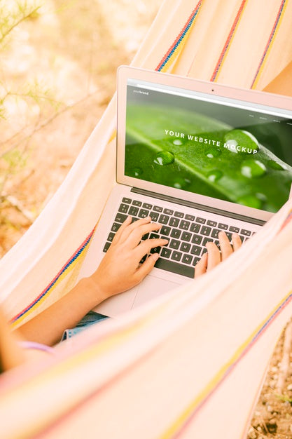 Free Woman Using Laptop Mockup In Nature Psd