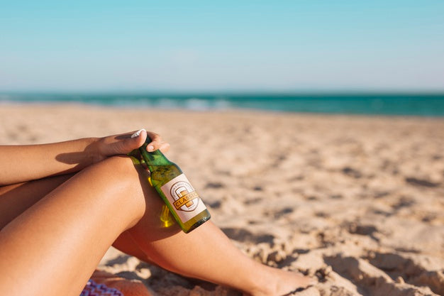 Free Woman With Beer Bottle Mockup At The Beach Psd