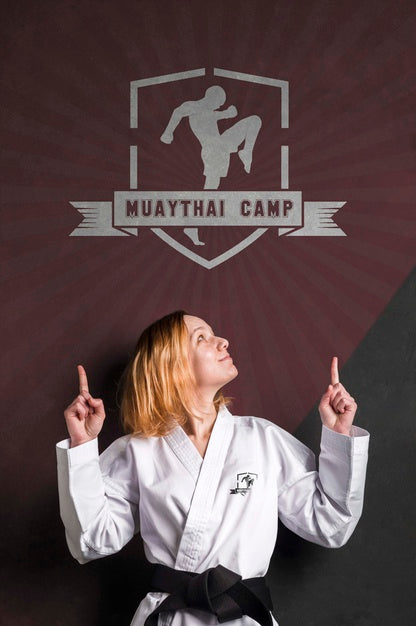 Free Woman With Karate Black Belt Pointing The Mock-Up Logo Psd