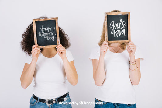Free Women Holding Slate In Front Of Face Psd