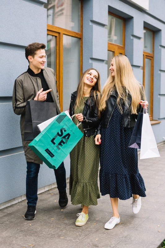 Free Women With Shopping Bags In City Psd