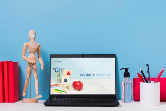 Free Wooden Mannequin And Laptop With Mock-Up Psd