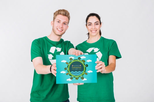 Free World Environment Day Mockup With Volunteer Couple Holding Paper Psd