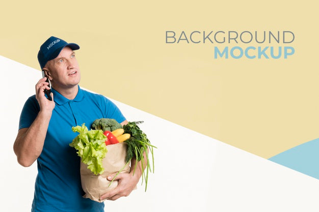 Free Worried Delivery Man Holding A Box With Different Vegetables Psd