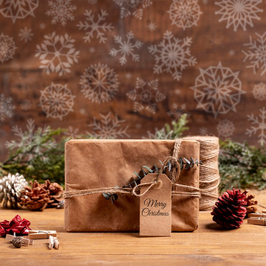 Free Wrapped Paper Gift With Label And Snowflakes Psd