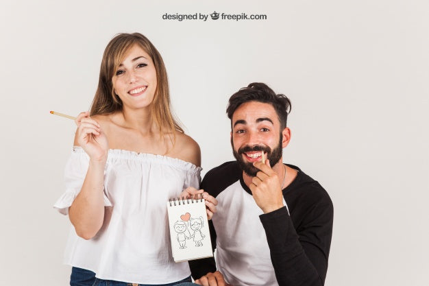 Free Young Couple Holding Notepad Psd