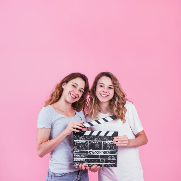 Free Young Girls Holding Clapperboard Psd