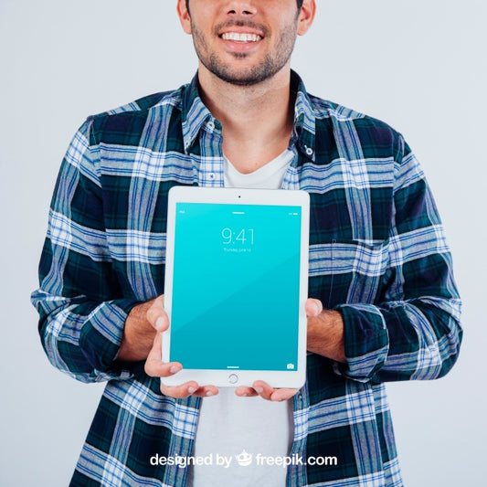 Free Young Guy Holding Tablet'S Mock Up Psd