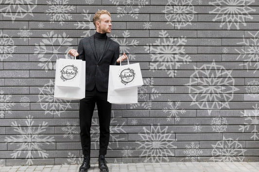Free Young Male Holding Shopping Bags Psd