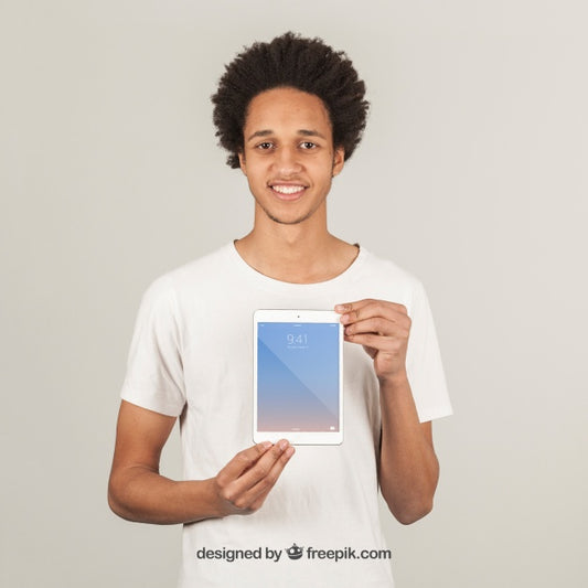 Free Young Man Showing Tablet Psd