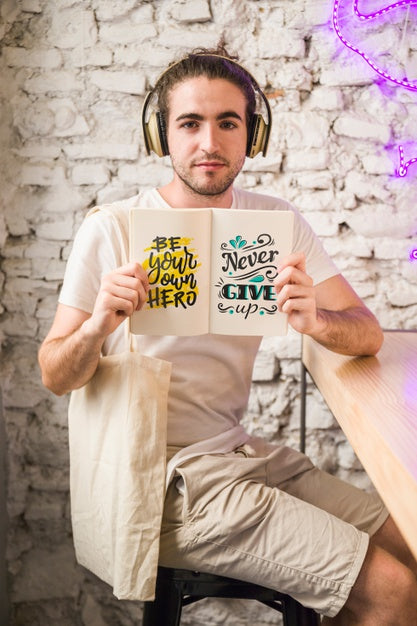 Free Young Man With A Open Book Mockup Psd