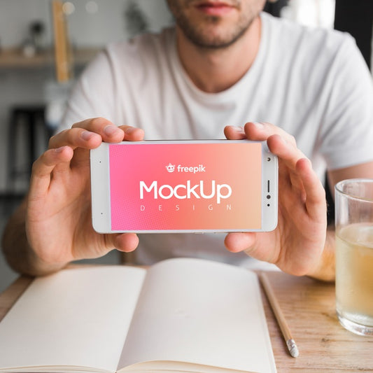 Free Young Man With A Smartphone Mockup Psd