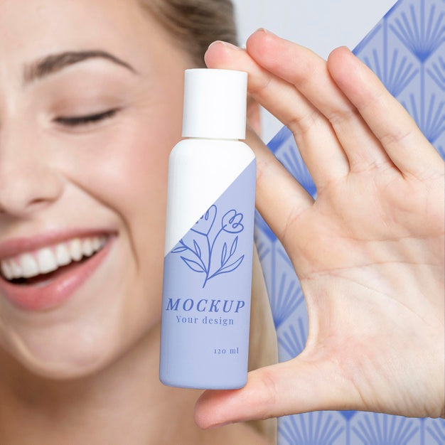 Free Young Woman Holding A Skincare Product Mock-Up Psd