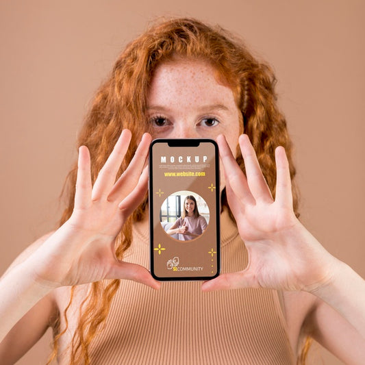 Free Young Woman Holding A Smartphone Mock-Up Psd