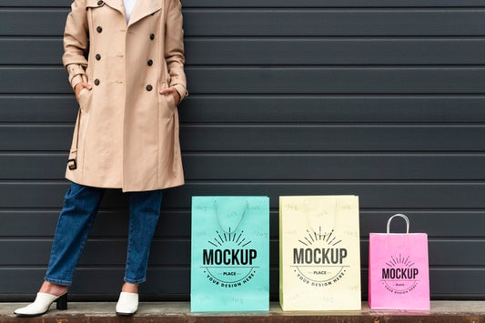 Free Young Woman Standing Next To Shopping Bags Mock-Up Psd